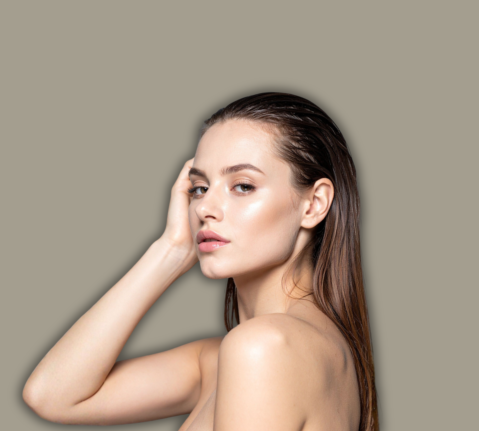 Woman with a neutral expression on a beige background - on brand colour of SKN AESTHETICS NZ